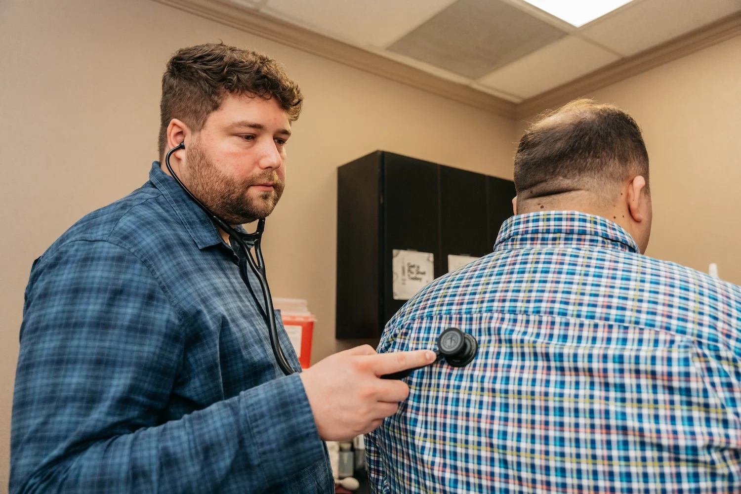Primary care provider listening to a patient at EveryDay Healthcare in Fresno